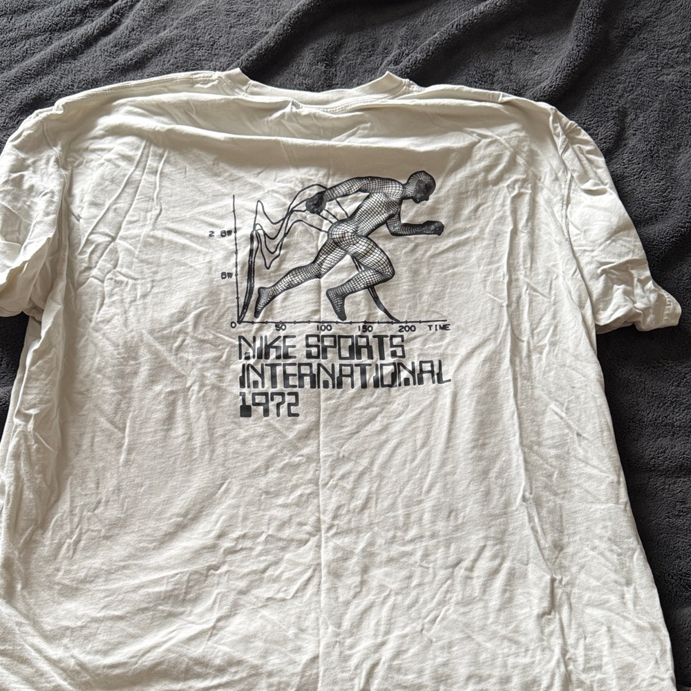 Nike cream Graphic Tee with Runner Design
